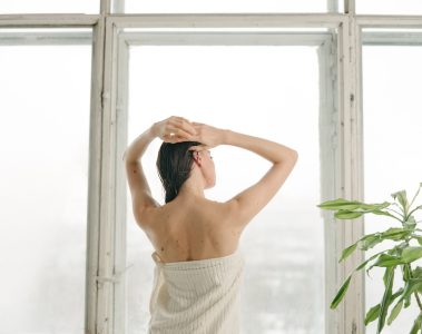PDRN - skincare - beauty - woman thinking about skincare looking out the window